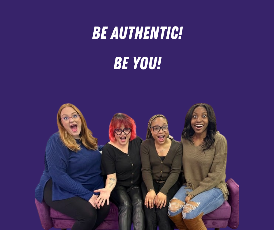 Four women sitting on a couch.